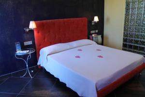 Abalon Pompei Resort客房内的一张或多张床位