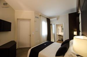 TV a/nebo společenská místnost v ubytování Porto Cesareo Exclusive Room