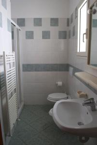 Ванная комната в Residence Hotel Baia del Sole