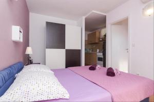 Posteľ alebo postele v izbe v ubytovaní Apartments Garmaz