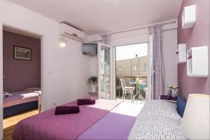 Posteľ alebo postele v izbe v ubytovaní Apartments Garmaz