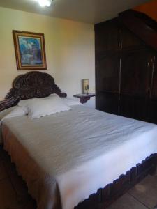 Кровать или кровати в номере Posada Bugambilias