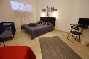 Postel nebo postele na pokoji v ubytování Dimora Hostel