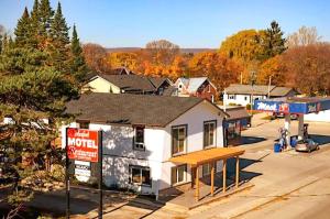 a motel building with a sign in front of it at Meaford Inn in Meaford