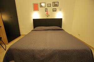 Letto o letti in una camera di Dimora Hostel