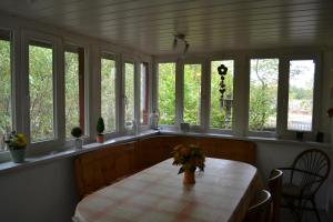 a room with a table with a bunch of windows at "Alter Bahnhof" Schalkenmehren in Schalkenmehren