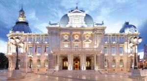 a large building with a clock on top of it at Cartagena Centro in Cartagena