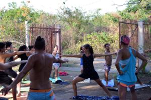 a group of people in a yoga class at Caracolito Hostal in Las Peñitas