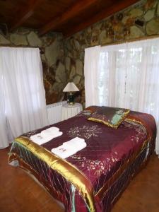 Ένα ή περισσότερα κρεβάτια σε δωμάτιο στο Casa Departamento en el Bosque