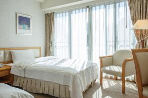 Ένα ή περισσότερα κρεβάτια σε δωμάτιο στο The Koos Hotel