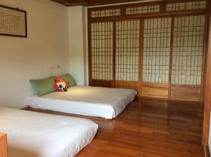 Una cama o camas en una habitación de Yuan Gong Yuan