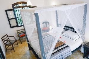 Ein Bett oder Betten in einem Zimmer der Unterkunft Kalahe House
