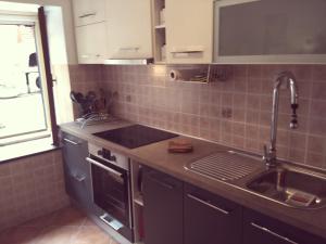 Kuchyň nebo kuchyňský kout v ubytování Apartman Nadia