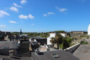 a view of a city from the roofs of houses at Residence Hoteliere Sarah Bernard in Le Palais