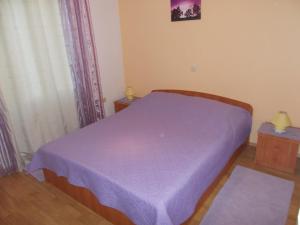 Postel nebo postele na pokoji v ubytování Apartments Makaus