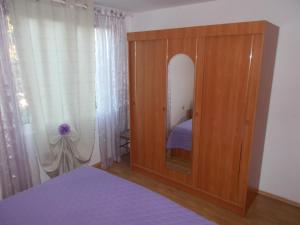 Postel nebo postele na pokoji v ubytování Apartments Makaus