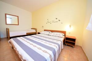 Postel nebo postele na pokoji v ubytování Apartment Prancic