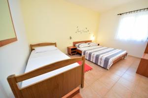 Postel nebo postele na pokoji v ubytování Apartment Prancic + 25 fotografií