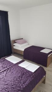 Posteľ alebo postele v izbe v ubytovaní apartmani mihaljević
