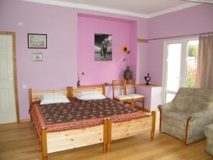 Een bed of bedden in een kamer bij Viesu nams Jūras Bura