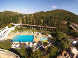 an aerial view of a resort with two pools at Dom Dinis Marvão in Marvão