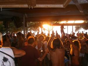 a crowd of people standing in a crowd at a party at Serenity Boutique Suites in Athanion