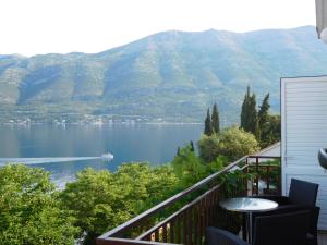 a balcony with a view of a lake and mountains at Apartments Ivancevic in Korčula