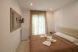 Postel nebo postele na pokoji v ubytování AVOCADO Skiathos