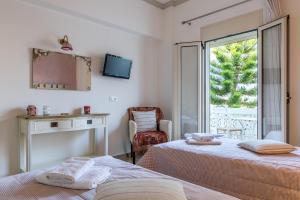 Postel nebo postele na pokoji v ubytování Argyro Rent Rooms