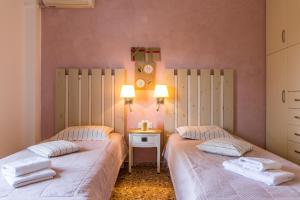 Postel nebo postele na pokoji v ubytování Argyro Rent Rooms