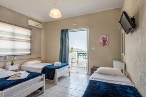 Postel nebo postele na pokoji v ubytování Argyro Rent Rooms