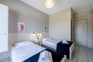 Postel nebo postele na pokoji v ubytování Argyro Rent Rooms