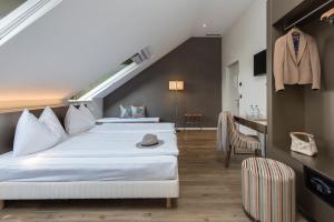 Postel nebo postele na pokoji v ubytování Hôtel du Théâtre, Boutique Hôtel