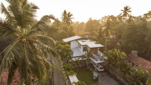 an aerial view of a house with palm trees at Villa Dominikku in Negombo