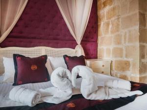 Postel nebo postele na pokoji v ubytování Chapel 5 Boutique Suites B&B