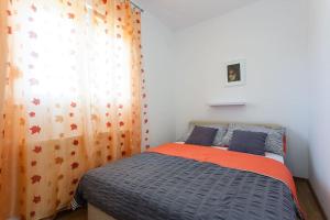 Posteľ alebo postele v izbe v ubytovaní Apartmani Jukic