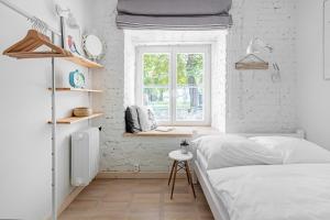 Katil atau katil-katil dalam bilik di Mariensztat Apartment