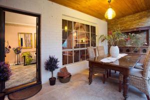a dining room with a table and a window at Hahndorf House B&B in Hahndorf