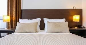 Posteľ alebo postele v izbe v ubytovaní Hotel Divan
