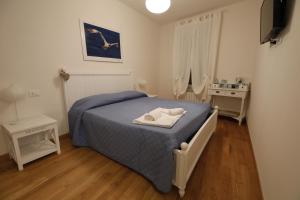 Postel nebo postele na pokoji v ubytování 5 TERRE PELAGOS 2
