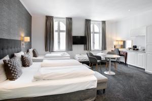 Postel nebo postele na pokoji v ubytování Hotel Tiffany