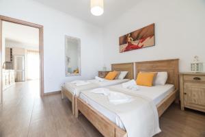 Posteľ alebo postele v izbe v ubytovaní Panos Apartment Naousa