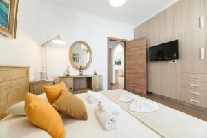 Posteľ alebo postele v izbe v ubytovaní Panos Apartment Naousa