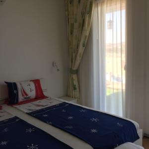 Ένα ή περισσότερα κρεβάτια σε δωμάτιο στο Apartment Antea Pontica +8 φωτογραφίες