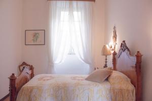 Giường trong phòng chung tại Villa Ruscone