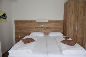 Postel nebo postele na pokoji v ubytování Hotel Tesla