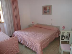 Voodi või voodid majutusasutuse Albergo Dei 10 Colori toas