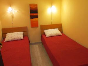 En eller flere senge i et værelse på Guest House Krasici