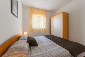 Postel nebo postele na pokoji v ubytování Apartments Marina + 37 fotografií