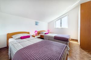 Postel nebo postele na pokoji v ubytování Apartments Marina